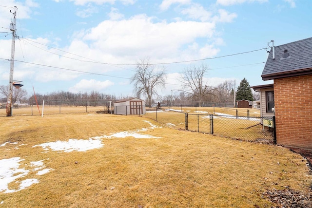 view of yard with an outbuilding and fence