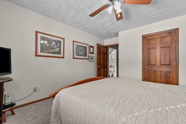 bedroom with carpet floors, ceiling fan, and baseboards