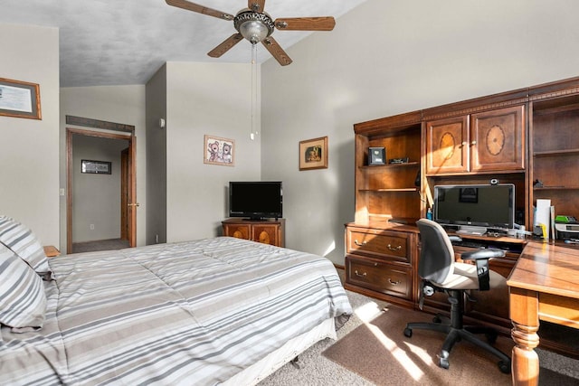 carpeted bedroom featuring high vaulted ceiling and a ceiling fan