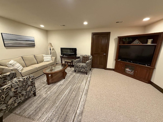 living room featuring baseboards, carpet flooring, visible vents, and recessed lighting