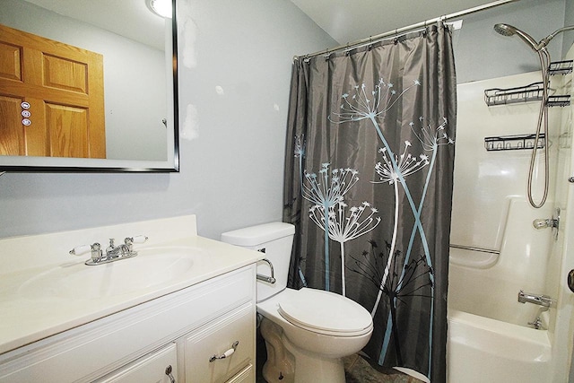 bathroom featuring toilet, shower / tub combo, and vanity