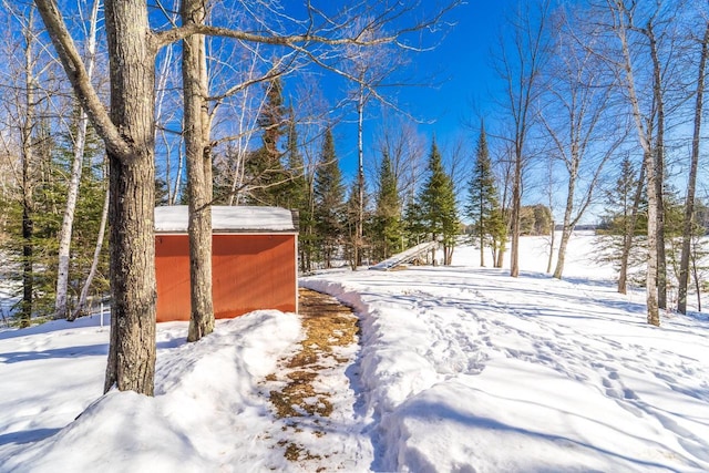 view of yard layered in snow