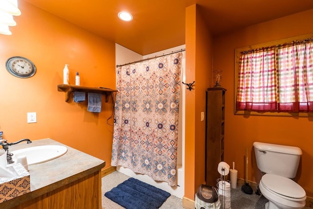 bathroom with toilet, recessed lighting, vanity, baseboards, and shower / bath combo