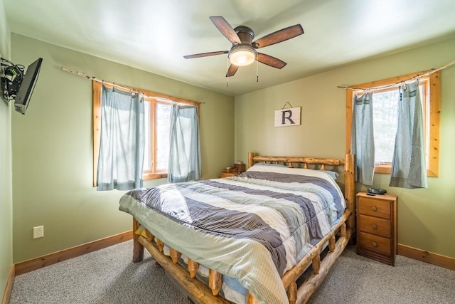 bedroom featuring carpet, baseboards, and a ceiling fan