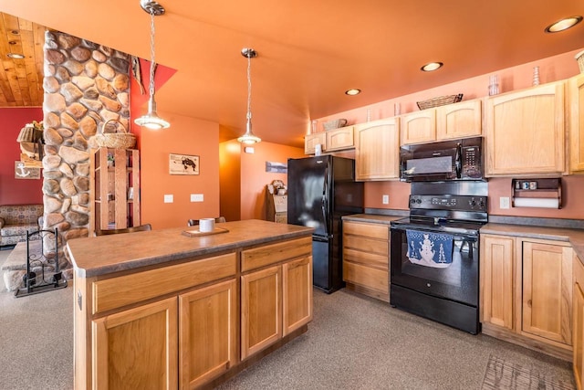 kitchen featuring dark countertops, decorative light fixtures, a kitchen island, and black appliances