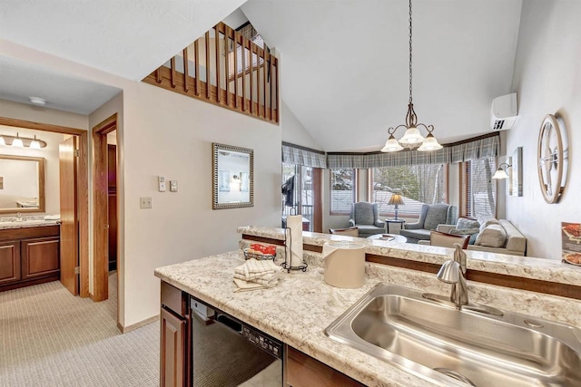 kitchen featuring black dishwasher, light colored carpet, open floor plan, decorative light fixtures, and a sink