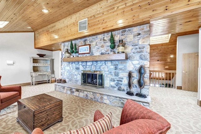 carpeted living room with wooden ceiling, a fireplace, visible vents, baseboards, and crown molding