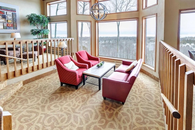 sunroom / solarium with an inviting chandelier