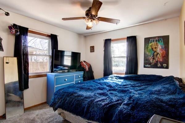 carpeted bedroom featuring a ceiling fan