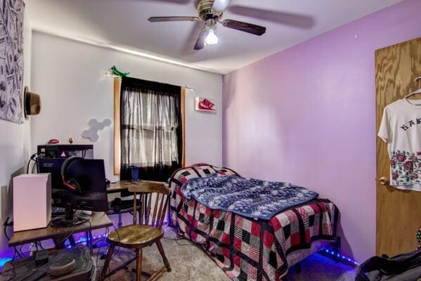 carpeted bedroom with a ceiling fan