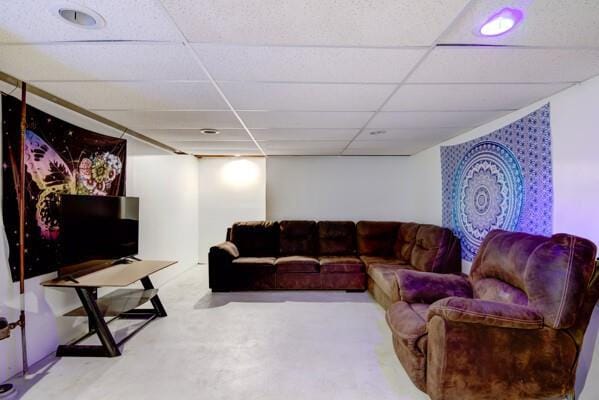 living room featuring a drop ceiling