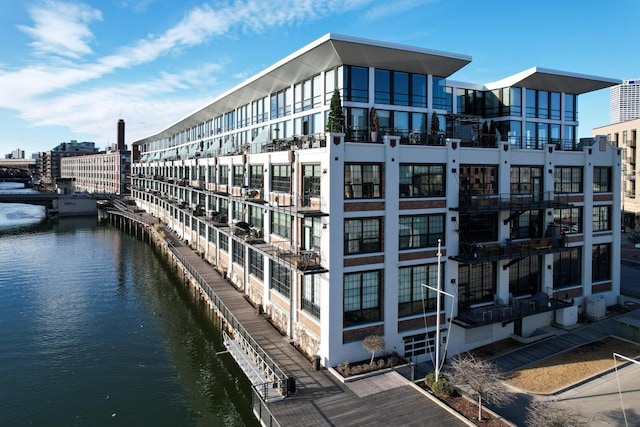 exterior space featuring a water view and a view of city