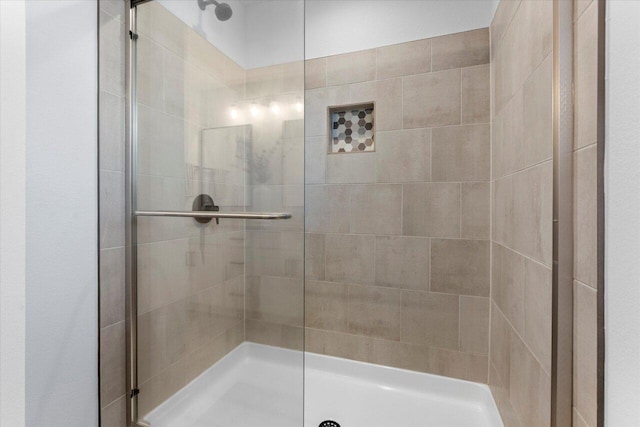 full bathroom featuring a stall shower