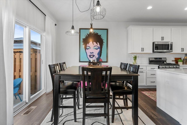 dining room featuring recessed lighting, visible vents, and dark wood finished floors