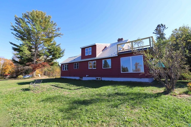 85780 Smith Dr, Port Wing, WI 54865 - back of house featuring metal roof, a yard, a chimney, and a standing seam roof