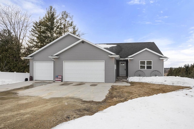 single story home with a garage, fence, driveway, and a shingled roof