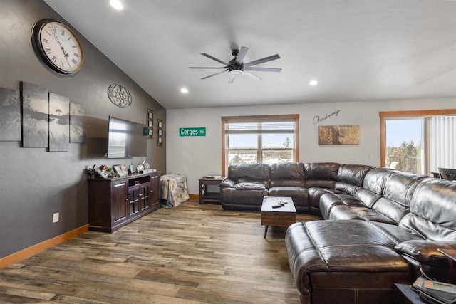 living room with vaulted ceiling, baseboards, wood finished floors, and recessed lighting