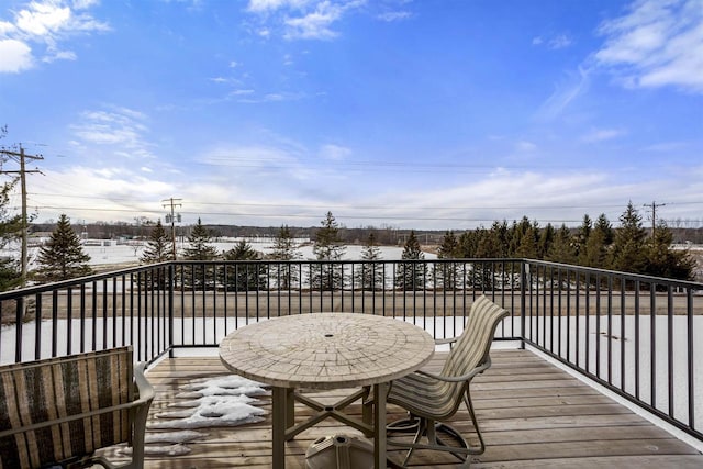 view of snow covered deck