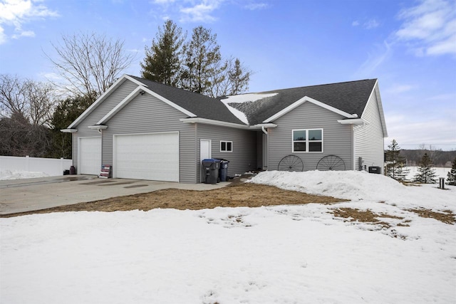 ranch-style home featuring driveway and an attached garage