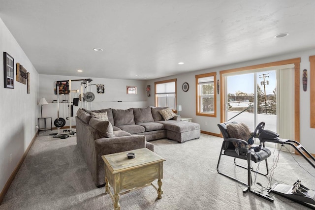 carpeted living room with recessed lighting and baseboards