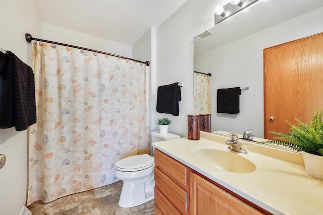 bathroom featuring vanity, a shower with shower curtain, and toilet