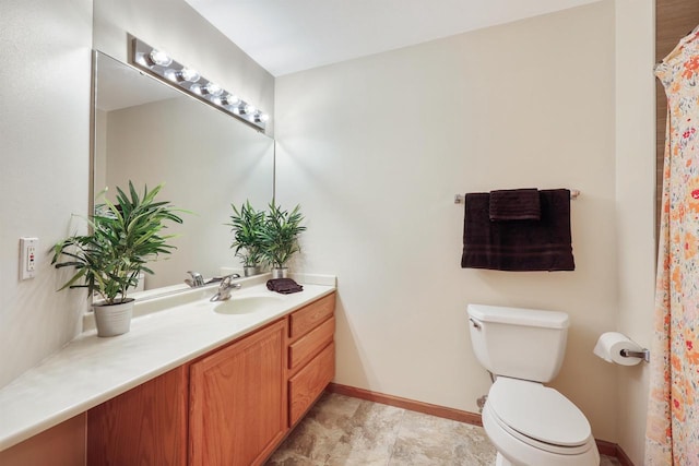 full bath featuring baseboards, toilet, and vanity