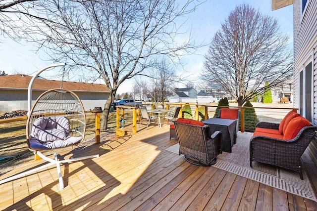 wooden terrace with an outdoor hangout area