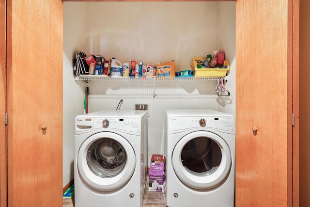 washroom with washer and clothes dryer and laundry area