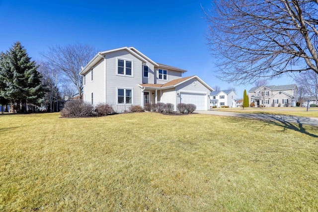 traditional-style house with a front lawn, a garage, and driveway