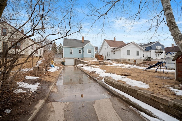 view of street featuring a residential view and curbs