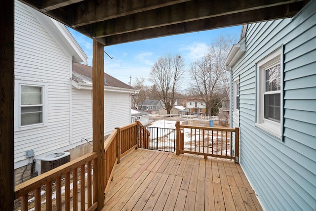 wooden terrace featuring cooling unit and a residential view