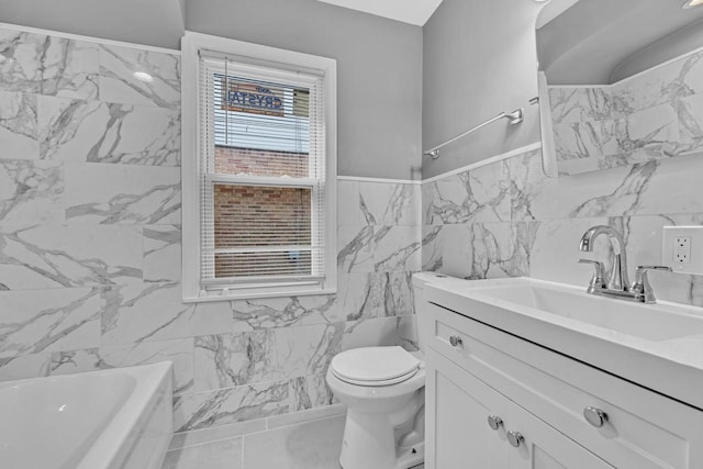 full bathroom featuring tile walls, vanity, toilet, and a bathing tub