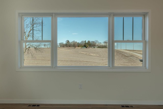 interior space featuring visible vents and baseboards