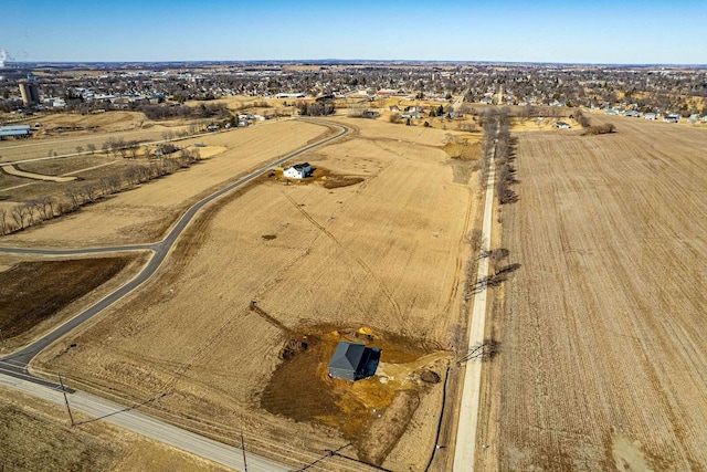 birds eye view of property featuring a rural view