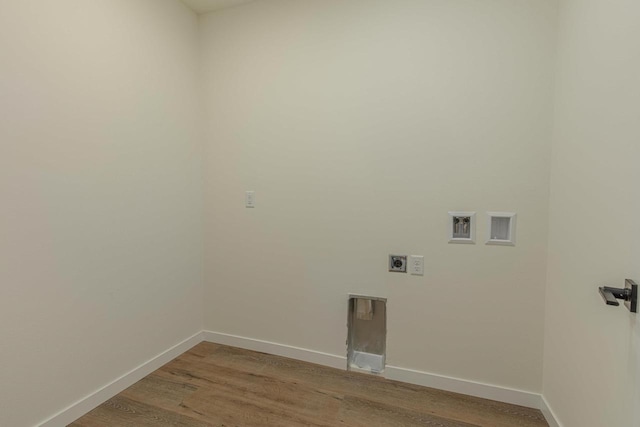 washroom with hookup for a washing machine, light wood-style flooring, hookup for an electric dryer, laundry area, and baseboards