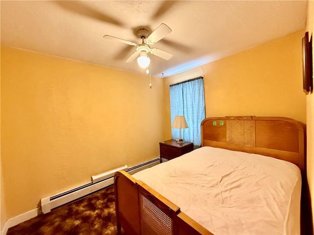 bedroom with a baseboard radiator, a ceiling fan, and baseboards