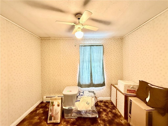 interior space featuring ornamental molding, a ceiling fan, baseboards, and wallpapered walls