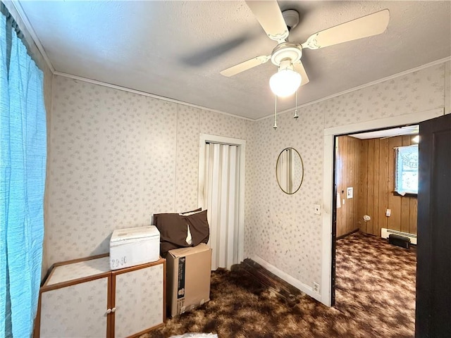 interior space featuring carpet floors, wallpapered walls, and baseboard heating