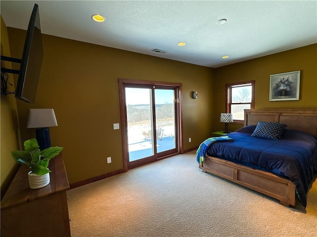 bedroom featuring a textured ceiling, light carpet, visible vents, baseboards, and access to outside