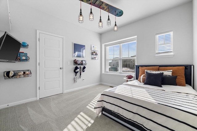 carpeted bedroom with baseboards