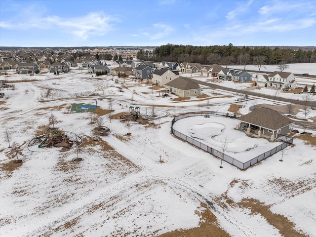 snowy aerial view featuring a residential view