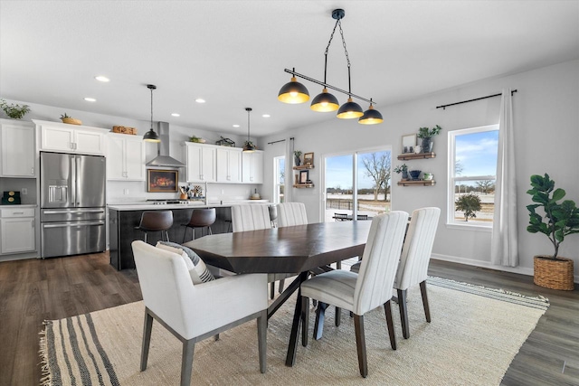 dining space featuring recessed lighting, dark wood-type flooring, and baseboards
