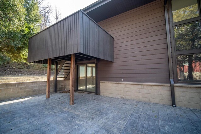 exterior space featuring stairway and a patio