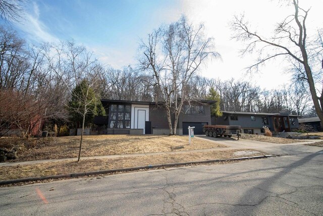 tri-level home with driveway and a garage