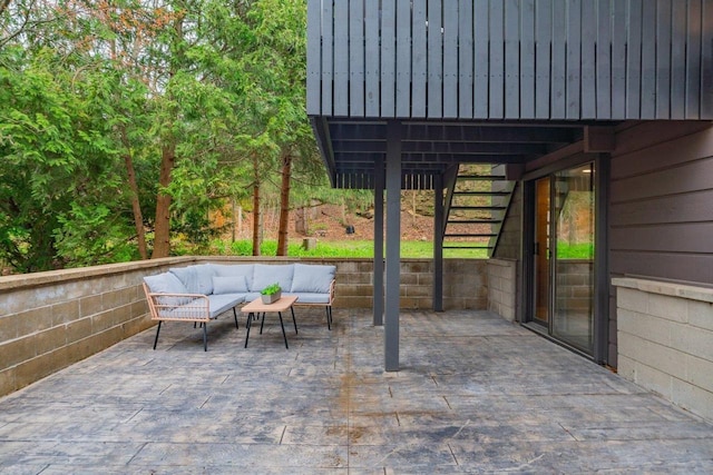 view of patio featuring outdoor lounge area and stairs