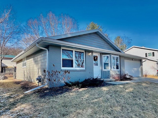 view of front of home with a garage and concrete driveway