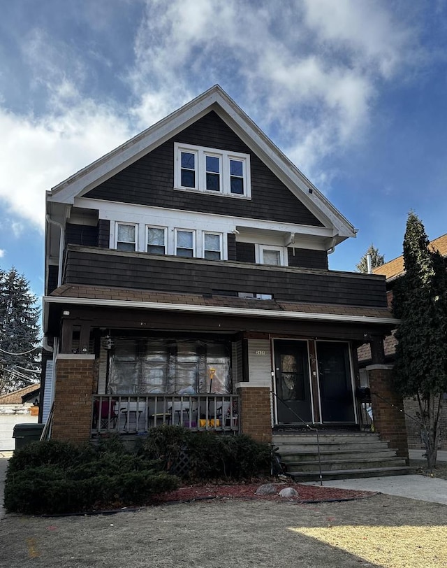 view of front of home featuring brick siding