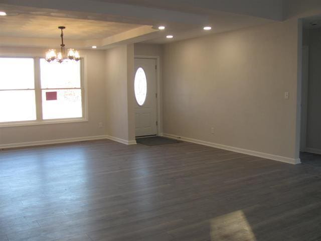 foyer with dark wood-style floors, recessed lighting, plenty of natural light, and baseboards