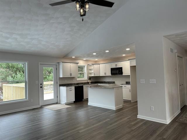 kitchen with black appliances, a kitchen island, white cabinets, and dark wood-style flooring