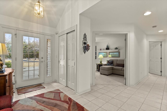 S32W32807 Bethania Ln, Dousman, WI 53118 - foyer with recessed lighting, vaulted ceiling, baseboards, and light tile patterned floors
